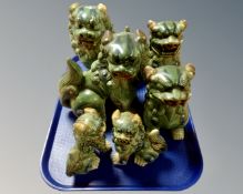 A tray containing three pairs of graduated Foo dogs.