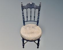 An antique Scandinavian painted bedroom chair.