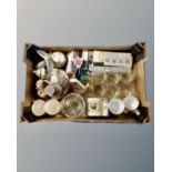 A box containing assorted glassware, commemorative mugs, spoons, Italian bride and groom figure.