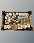 A box containing assorted glassware, commemorative mugs, spoons, Italian bride and groom figure.