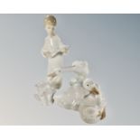 Four Lladro and Nao figures, angel with lute, polar bear cub and ducks.