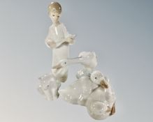 Four Lladro and Nao figures, angel with lute, polar bear cub and ducks.