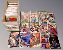 A box containing a quantity of Marvel comics including Excalibur, X-Man, Tarzan, Wildcats, Iron Man,