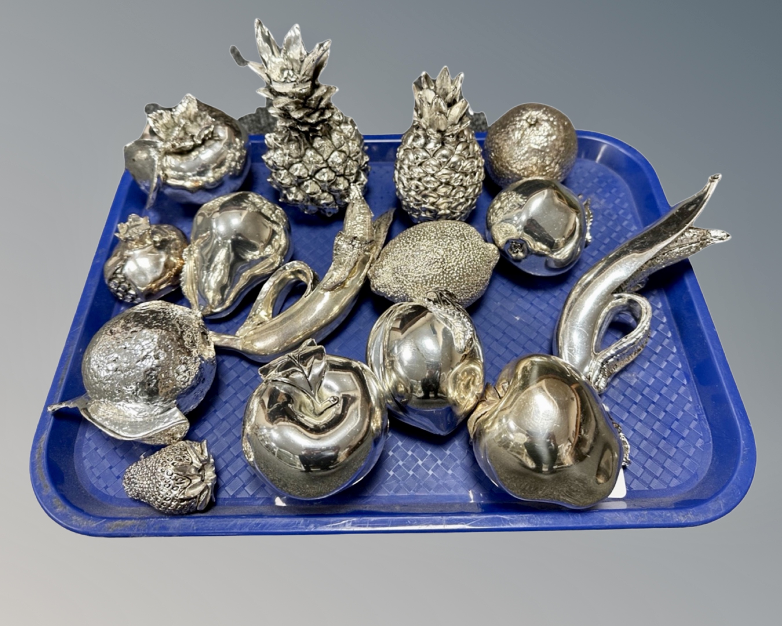 A collection of 15 continental metallic coated fruit ornaments.