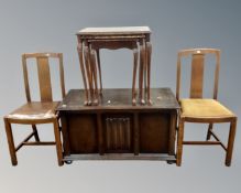 A nest of three glass topped occasional tables together with a linen fold blanket box and a pair of