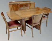 A mid-20th century walnut six piece dining room suite comprising of cocktail sideboard,