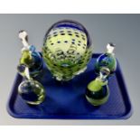 A tray of five pieces of blue and green art glass ware to include four perfume bottles with