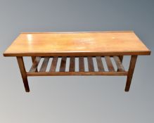 A mid-20th century rectangular teak coffee table with undershelf (length 131cm)