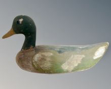 A painted wooden decoy duck.