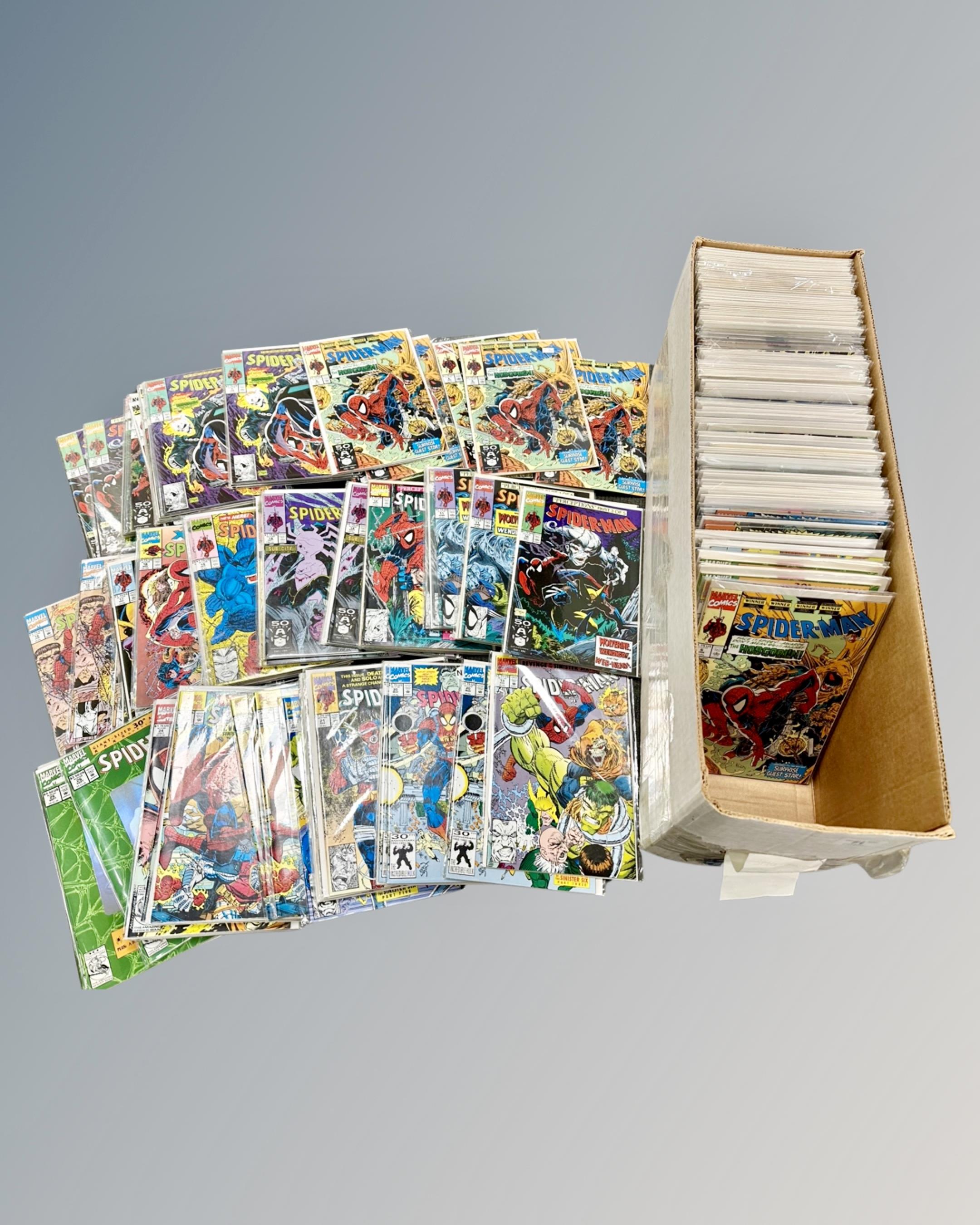 A box containing a large collection of 1990s and later Marvel Spider-Man comics including various