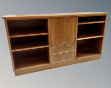 A set of mid-20th century Danish open bookshelves fitted with drawers and central cupboard (width