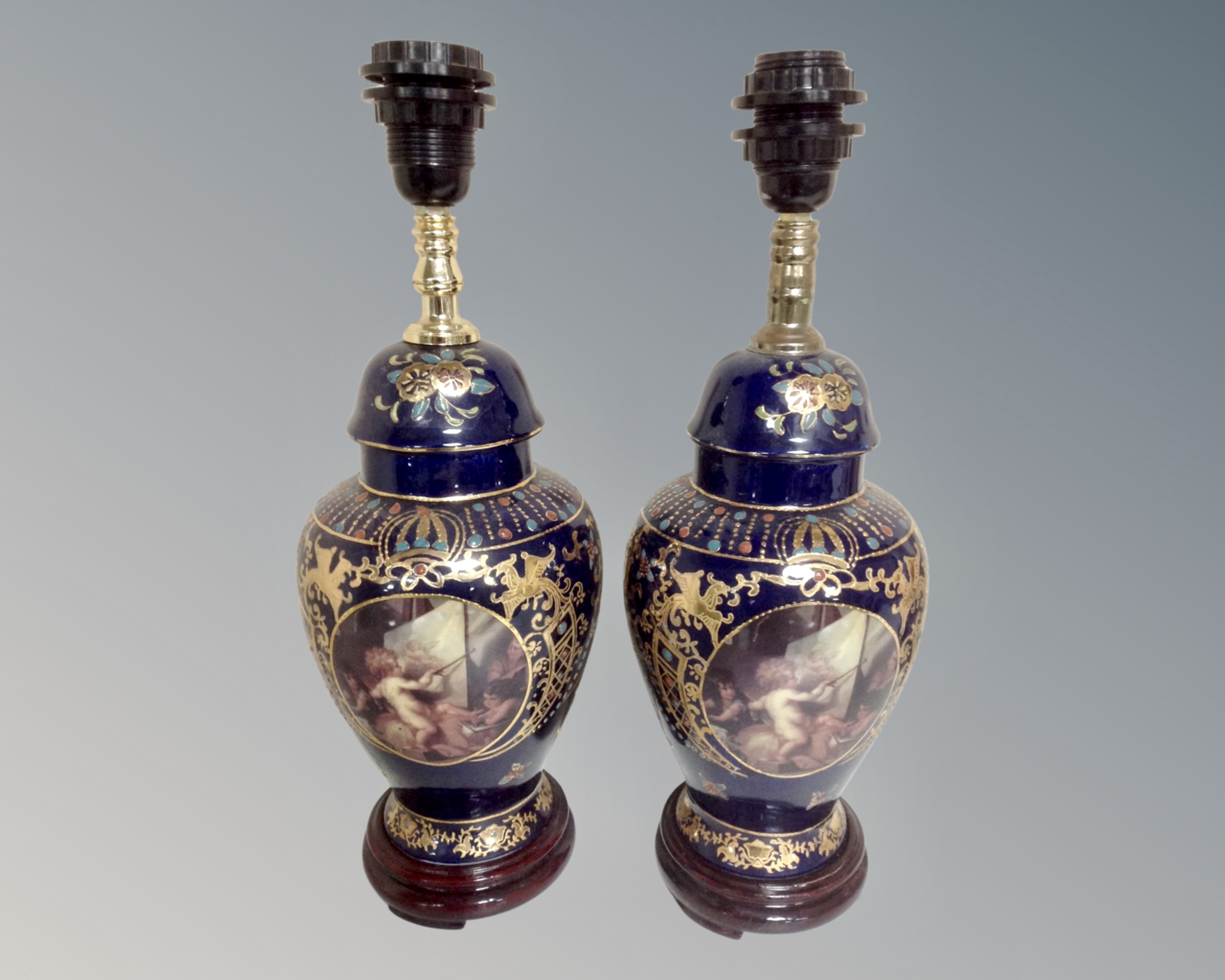 A pair of French style gilt porcelain lamp bases.