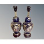 A pair of French style gilt porcelain lamp bases.