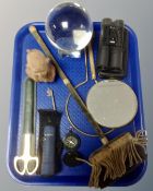 A tray containing compass, monocular, a pair of 16x32 binoculars, crystal ball, brass mirror etc.