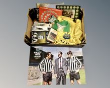 A box of football ephemera including world cup collection coins, Newcastle United shirt,