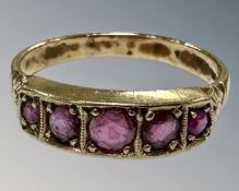 A 9ct gold five stone ruby ring, R½, 3.1g.