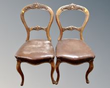 A pair of 19th century dining chairs on cabriole legs.