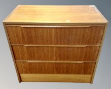 A mid-20th century three drawer chest.