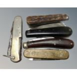 Five vintage pocket knives.