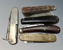Five vintage pocket knives.