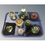 A tray of eight glass paperweights to include Mdina,