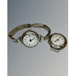 Two vintage silver watches one on silver strap.