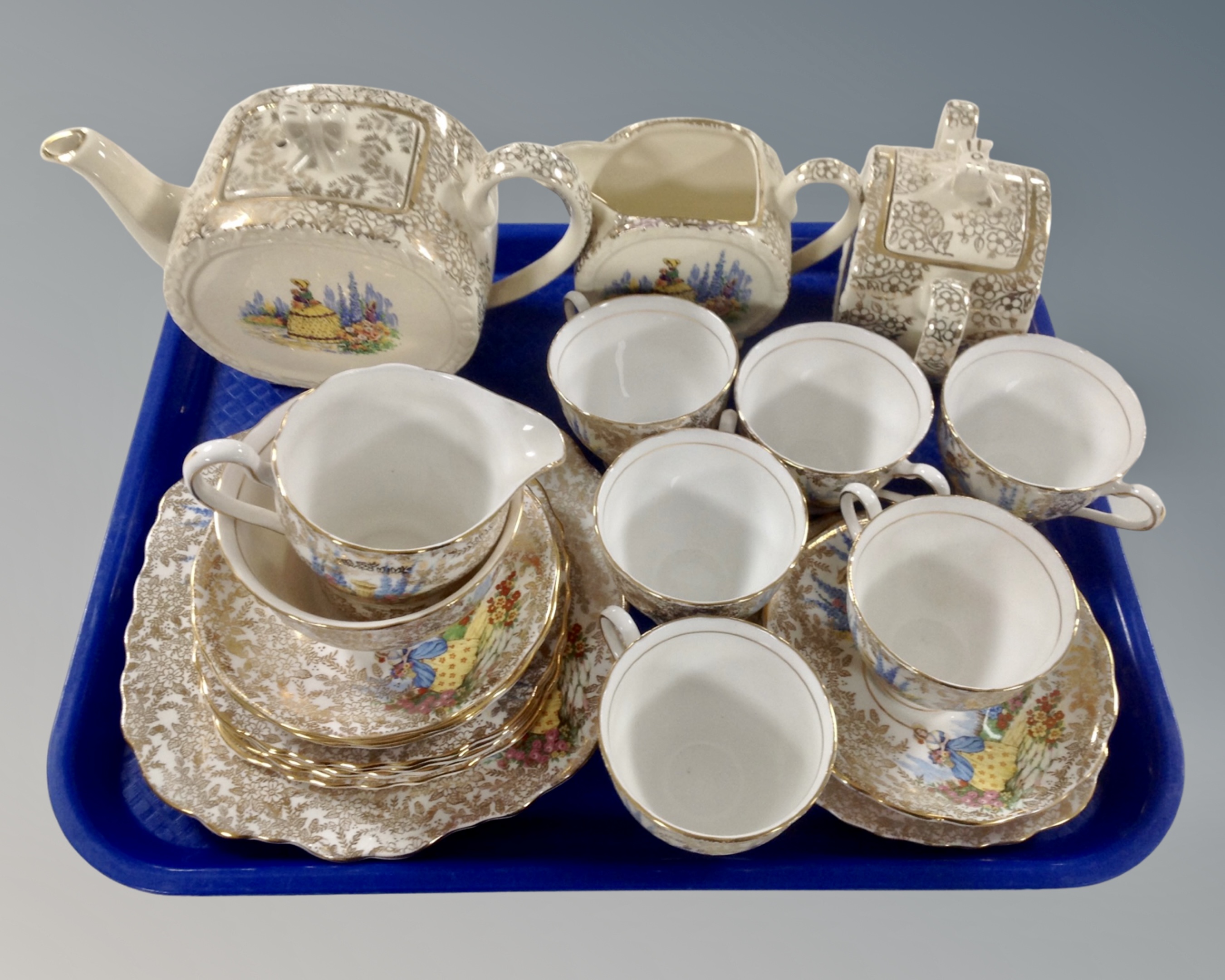 A tray of approximately 24 pieces of antique Colclough gilt tea china.