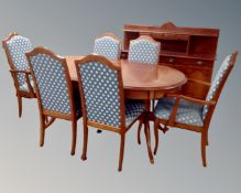 A White & Newton oval extending dining table together with a set of six chairs,