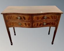 A Regency style serpentine fronted four drawer serving table on raised legs (width 107cm)