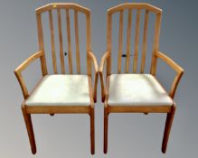 A pair of contemporary open armchairs.