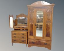 An Edwardian walnut mirror door wardrobe fitted a drawer together with dressing chest with triple