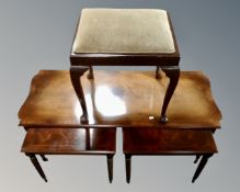 A nest of three Regency style tables together with a painted dressing table stool on Queen Anne