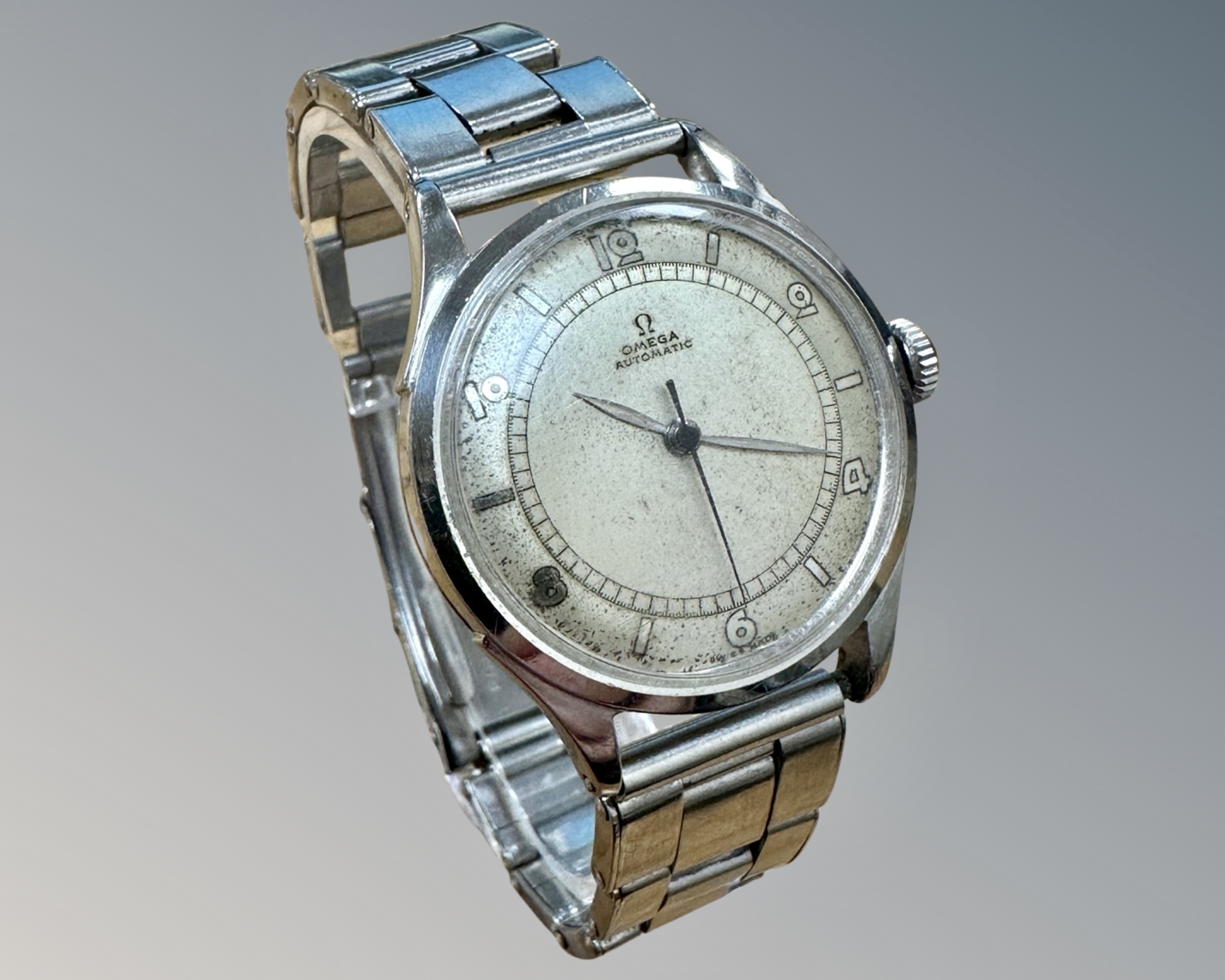 A gent's stainless steel Omega automatic centre seconds wristwatch, circa 1944, Omega crown,
