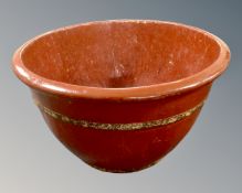 A Chinese red lacquered barrel planter,