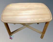 A Scandinavian pine occasional table (width 69cm)