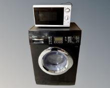 A black Bosch Exxcel washer together with a microwave.