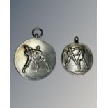 Two silver boxing medallions.