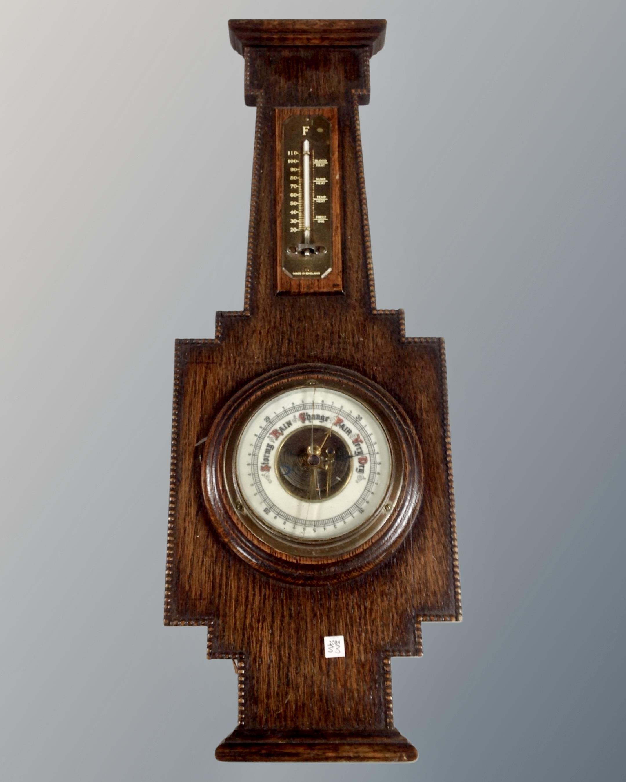 An oak Arts & Crafts barometer