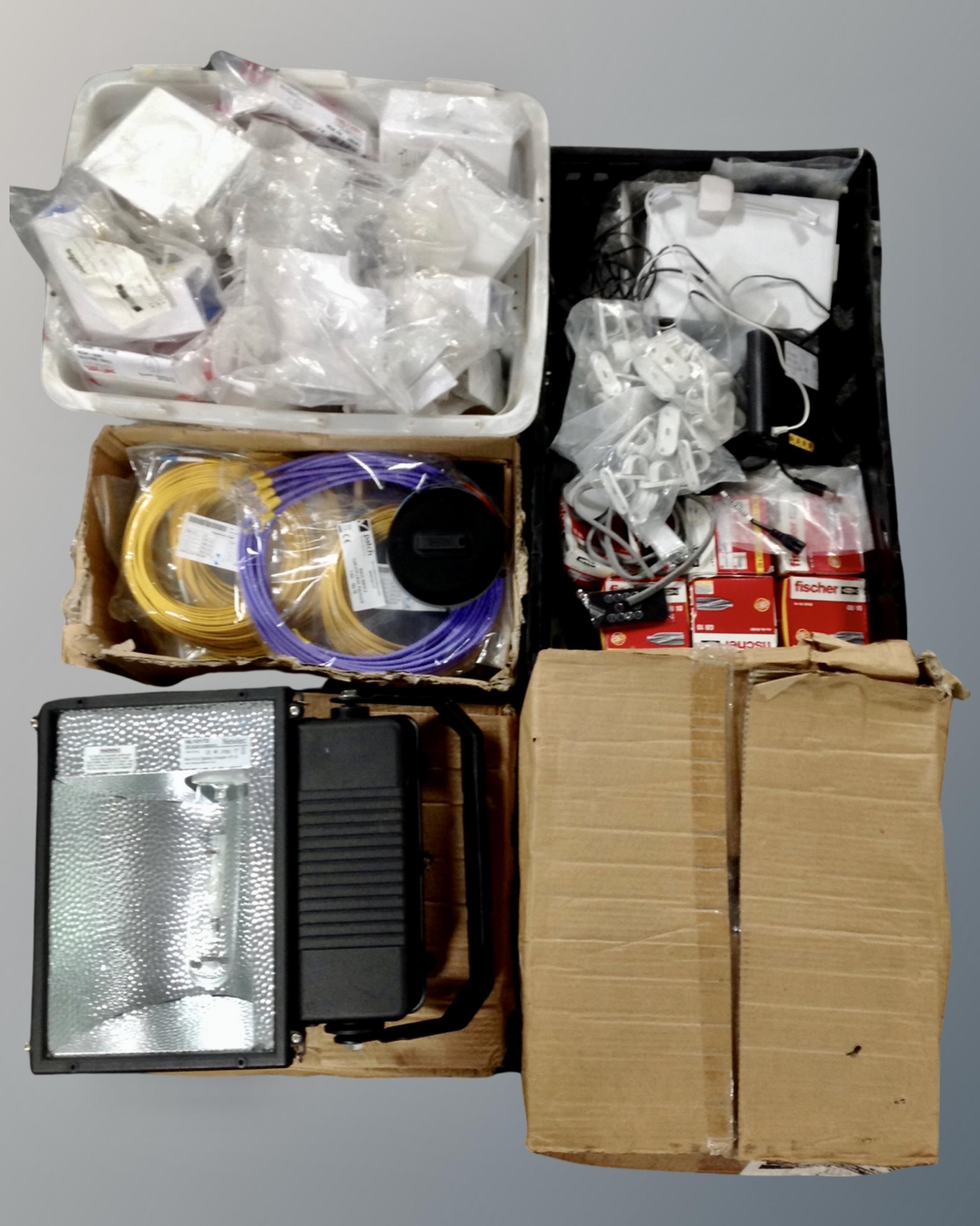 Four Newnec reflector lights together with three crates containing data cables, plastic fittings,