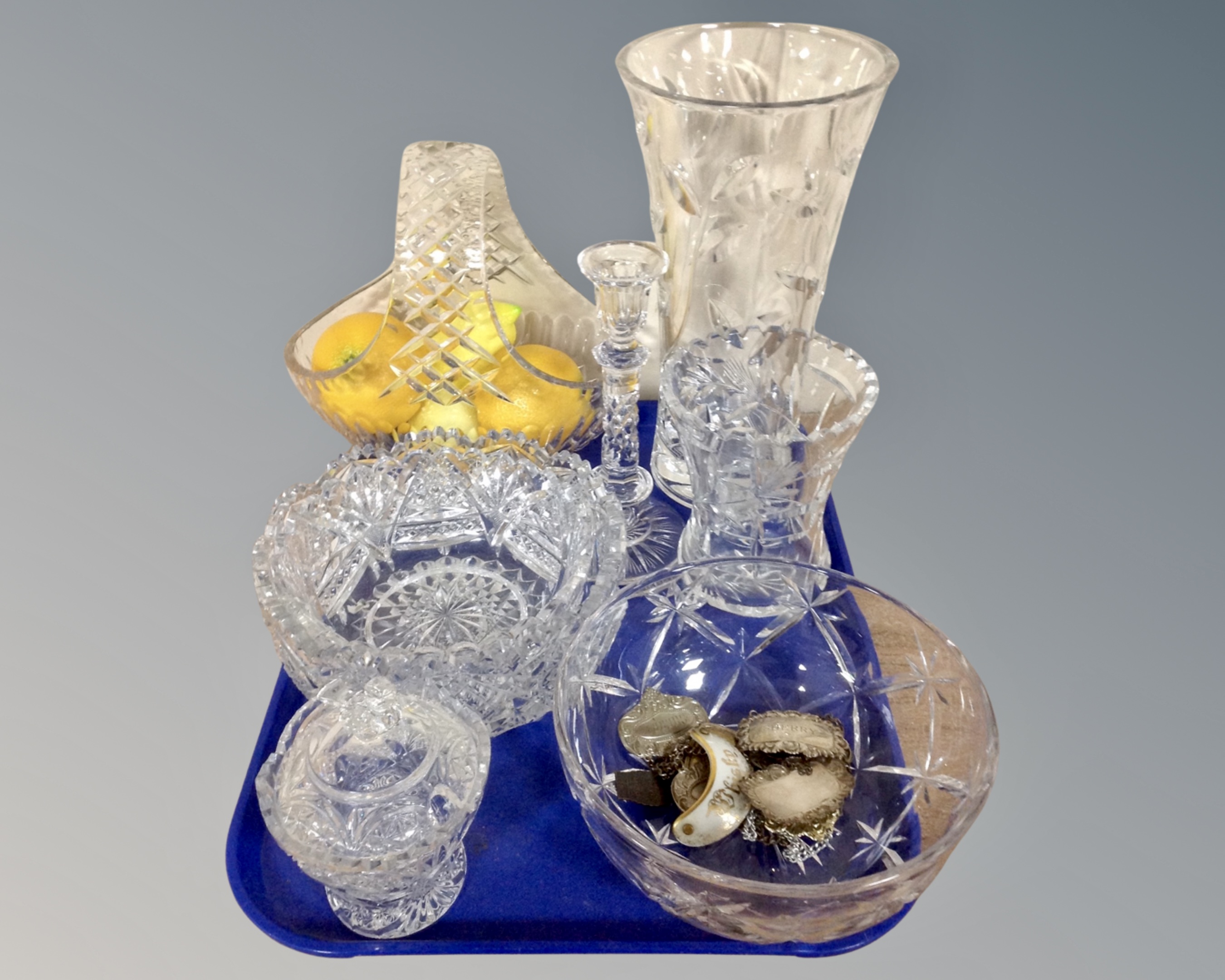 A tray of assorted cut glass and lead crystal glass ware to include basket, bowls, candlestick,