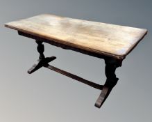 An oak refectory dining table (length 165cm) together with a set of five ladderback chairs,
