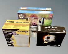 A boxed Nespresso Essenza mini coffee maker together with a boxed HP printer and a Fellowes paper