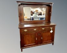 An Edwardian mahogany Arts and Crafts mirror back sideboard (width 130cm)