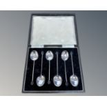 A set of six silver coffee spoons.