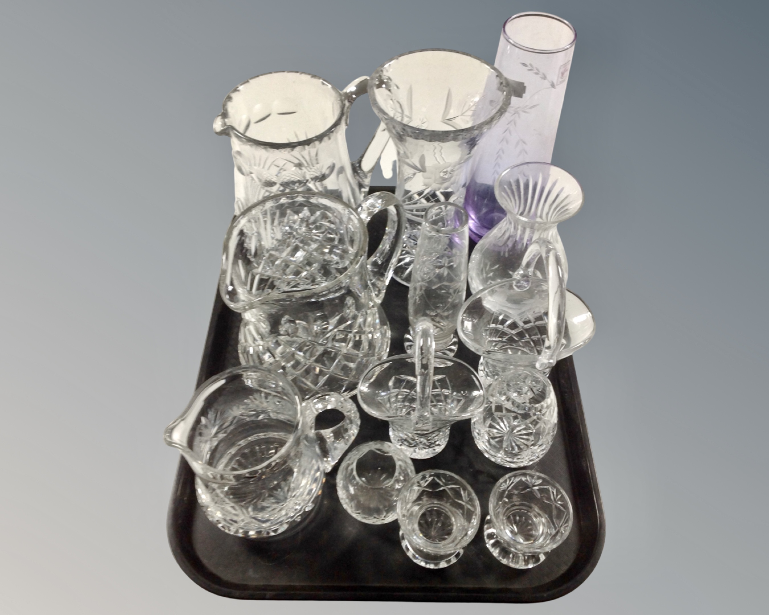 A tray of assorted glass ware to include lead crystal jugs, vases,