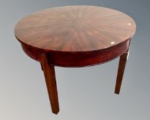 An antique continental mahogany circular dining table (width 110cm)