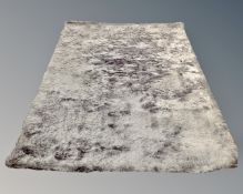 A contemporary silver shaggy pile rug, 227cm by 164cm.