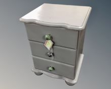 A painted pine three drawer bedside chest (width 45cm)