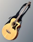 A Tanglewood model TAB-2CE-STO semi-acoustic bass guitar, with Ritter soft carry bag.