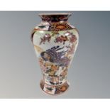 An Oriental porcelain vase , height 21 cm.